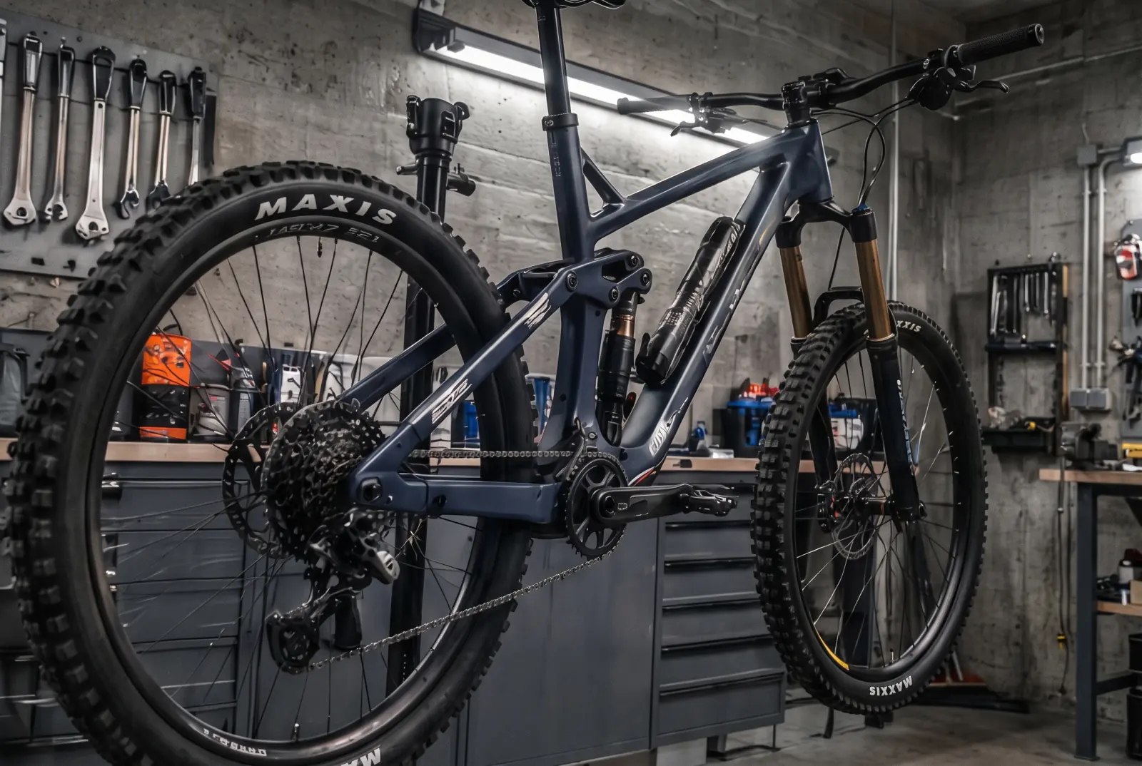 A suspension fork stripped down on the bench for a service